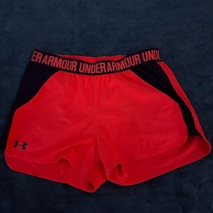 Under Armour. Orange color sunset with some purple. Size medium. Loose fit.